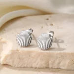 Bijoux en acier inoxydable, boucle d'oreille coquillage pour femme, durabilité et style.