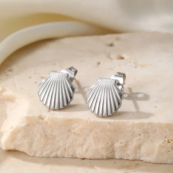 Bijoux en acier inoxydable, boucle d'oreille coquillage pour femme, durabilité et style.